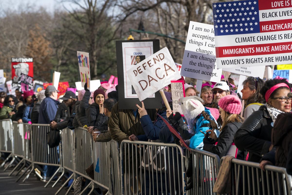 People line up on Central Park West as they wait for the start of a march highlighting equal rights and equality for women Saturday, Jan. 20, 2018, in New York. The New York protest was among more than 200 such actions planned for the weekend around the world. (Craig Ruttle / Associated Press)