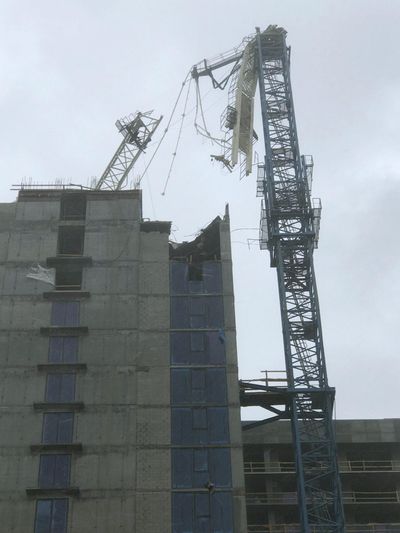 A crane atop a high-rise under construction in downtown Miami collapsed Sunday, Sept. 10, 2017, amid strong winds from Hurricane Irma. (Gideon J. Ape / Associated Press)