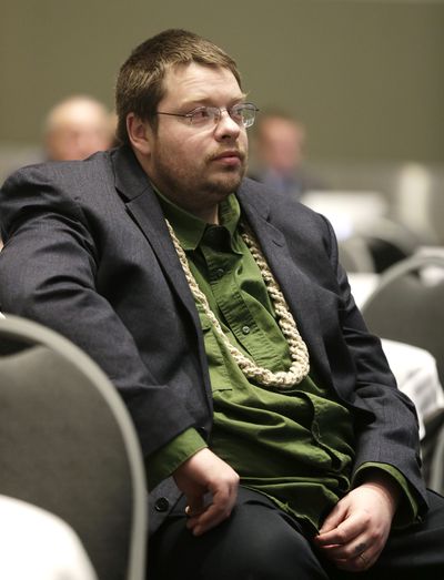 Bill Thomas, of Clarkston, wears a large hemp necklace Wednesday in Tacoma as he attends an information session put on by Washington’s Liquor Control Board for people interested in bidding for consultant contracts with the state to advise on the implementation of legal marijuana use, which was passed into law by voters in 2012. (Associated Press)