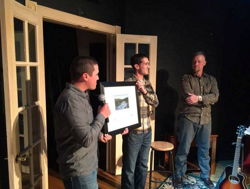 Sean Visintainer, left, and Michael Visintainer, center, of Silver Bow Fly Shop in Spokane Valley are honored by the Spokane Riverkeeper for conservation service to the river. (Courtesy)