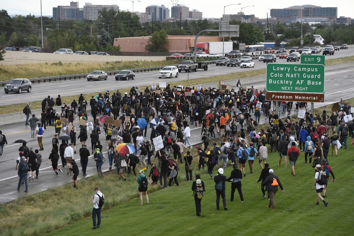 Demonstrators shut down Interstate 225, Saturday, July 25, 2020, in Aurora, Colo., during a protest against racial injustice and the death of Elijah McClain, who was stopped by police while walking down an Aurora street in August 2019 after a 911 caller reported him as suspicious. (Andy Cross)