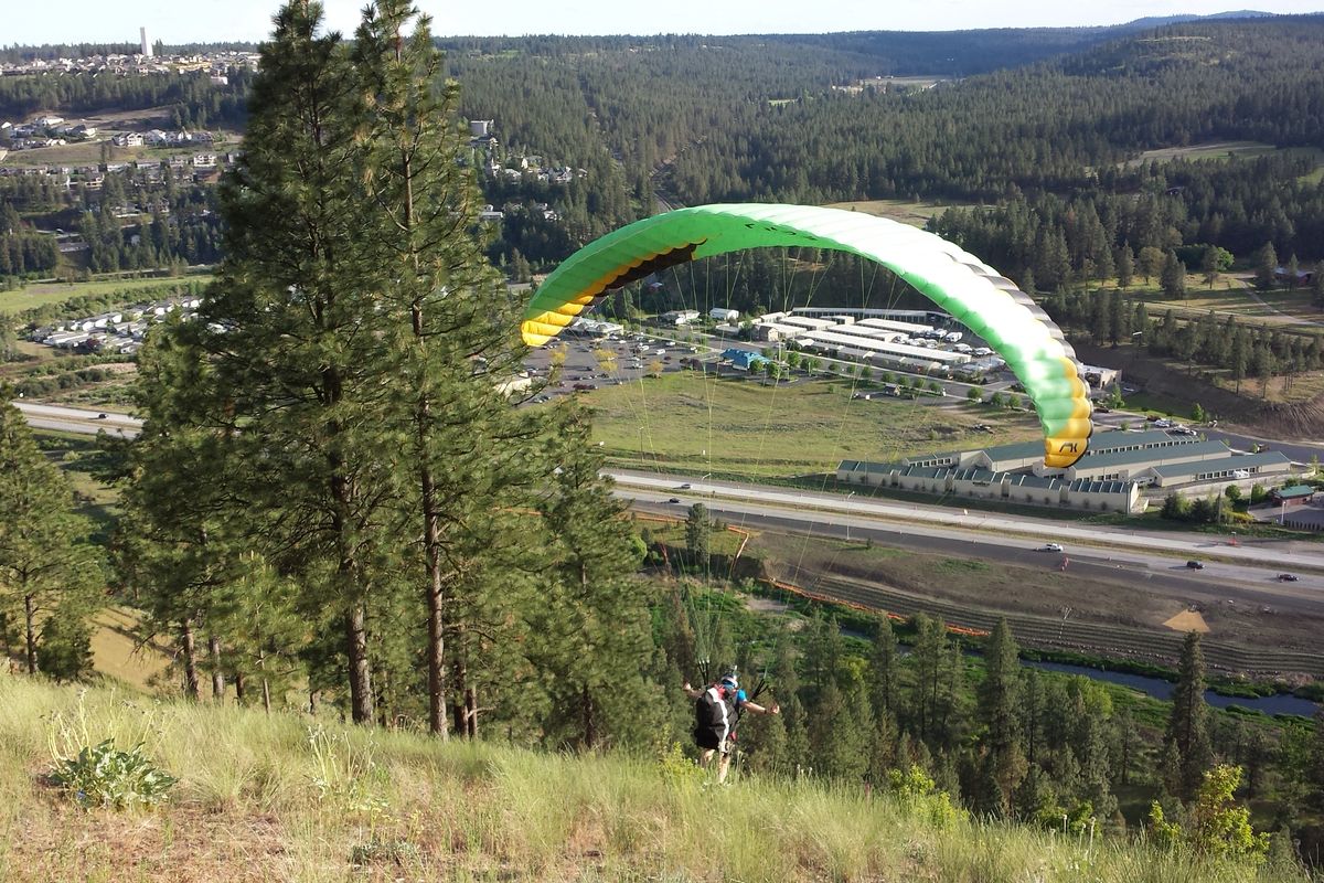 Paraglider Jonathan Woodruff launches from High Drive on May 19, 2014. (Rich Landers)