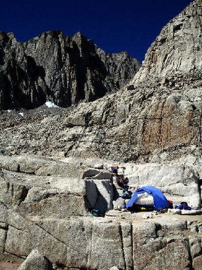 
With Mount Whitney looming in the background, Whitney Hill and her father, Wyn, make camp on a granite ledge along the Mount Whitney Trail.
 (Rich Landers / The Spokesman-Review)