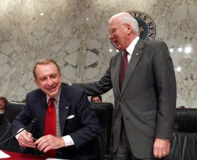 
Senate Judiciary Committee Chairman Arlen Specter, R-Pa., left, gets a pat on the back from Sen. Patrick Leahy, D-Vt., on Friday at the conclusion of the confirmation hearing for Supreme Court nominee Samuel Alito. 
 (Associated Press / The Spokesman-Review)
