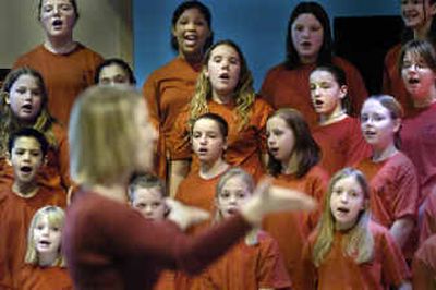 
Dawn Grey leads the Longfellow School Choir through 