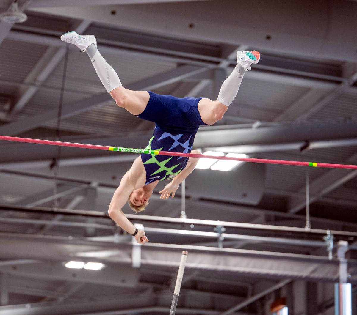 Pole vaulter Chris Nilsen clears the bar at 19 feet, 4¾ inches to win the event at the USATF Indoor Championships Saturday at the Podium.  (JESSE TINSLEY)