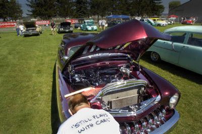 
Jerry England of West Richland, Wash., prepares his 1951 Mercury at the Spokane Fair and Expo Center on Friday. 