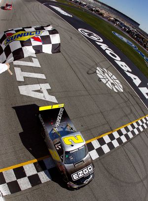 Kevin Harvick crosses the finish line to get his first win at Atlanta Motor Speedway during Sunday’s in the NASCAR Camping World Truck Series. (Photo courtesy of Brian Lawdermilk/ HHP - Pool/Getty Images for NASCAR)