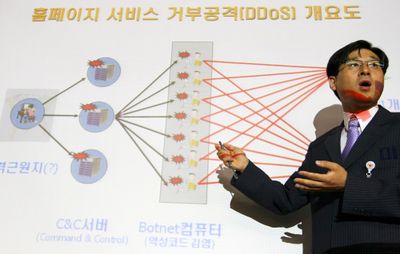 An official gives a briefing about cyber attacks Wednesday at the National Police Agency in Seoul, South Korea. South Korean officials believe North Korea or pro-Pyongyang forces in South Korea committed cyber attacks that paralyzed major South Korean and U.S. Web sites.  (Associated Press / The Spokesman-Review)