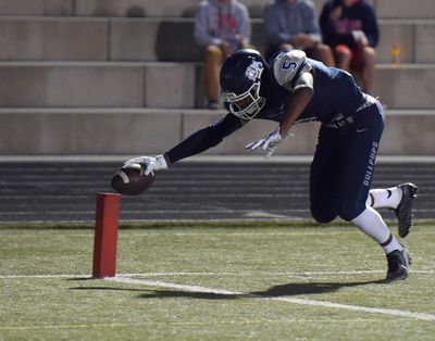 Gonzaga Prep wide receiver Devin Culp  scores the Bullpups first touchdown during the first half of a high school football game at Gonzaga Prep, Friday, Sept. 9, 2016, in Spokane. (Colin Mulvany / The Spokesman-Review)