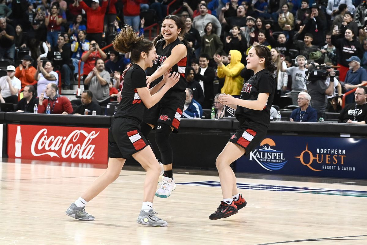 Neah Bay Red Devils celebrate after a 56-54 win over Mossyrock Vikings during the State 1B Girls Championship game held at the Spokane Arena on Sat. March. 4, 2023 in Spokane WA.  (James Snook)