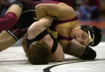 
Cheney's 130-pounder, Blake Risk, top, had West Valley's Seth Koker in a heap of trouble at the District 5/8 3A subregional wrestling tournament on Saturday.
 (Amanda Smith / The Spokesman-Review)