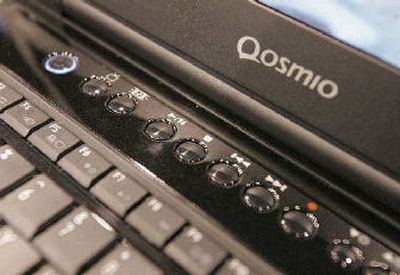 
Toshiba's Qosmio series laptop computer with instant movie control buttons is seen at the Consumer Electronic Show in Las Vegas. 
 (Associated Press / The Spokesman-Review)