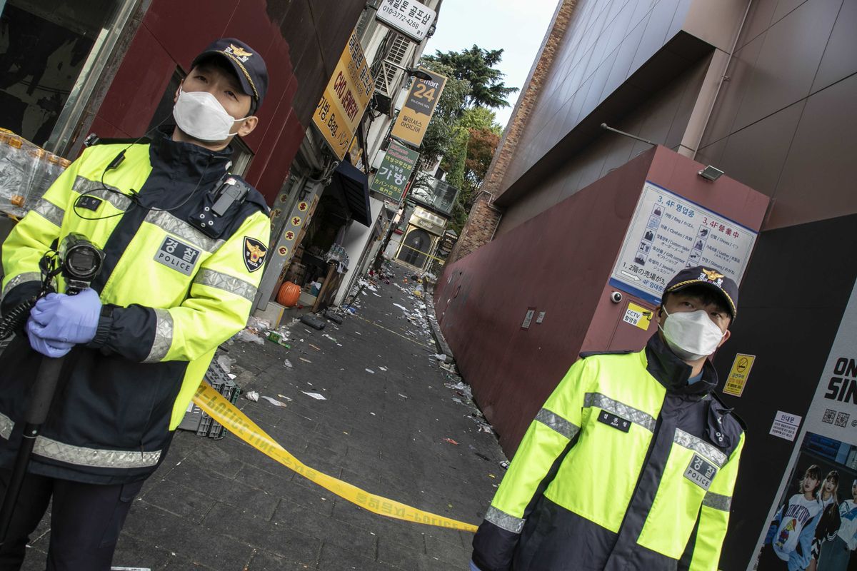 Police stand guard at the accident site in Itaewon on Sunday. MUST CREDIT: Photo for The Washington Post by Jean Chung (Jean Chung/For The Washington Post)