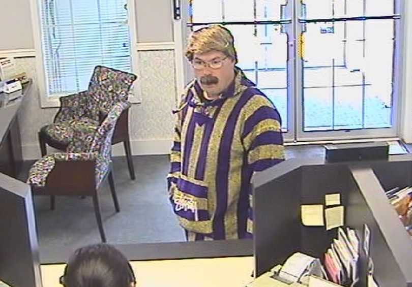 The FBI is looking for this man, who robbed the INB bank branch at Hawthorne Road and Nevada Street at gunpoint Tuesday, Sept. 29, 2009. Officials say the suspect tied up bank employees with duct tape during the robbery.  Courtesy of SPD (Courtesy Spd / The Spokesman-Review)