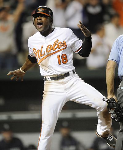 Baltimore's Felix Pie reacts after scoring winning run Tuesday. (Associated Press)