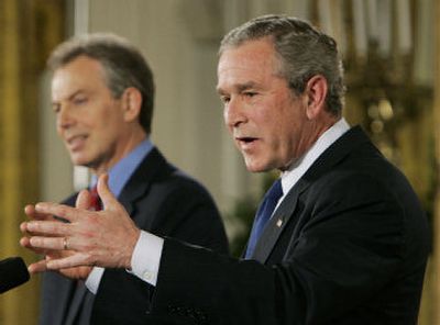 President Bush and British Prime Minister Tony Blair speak to reporters  Thursday at the White House. Neither leader indicated  a time frame for the drawdown of military forces. 
 (Associated Press / The Spokesman-Review)