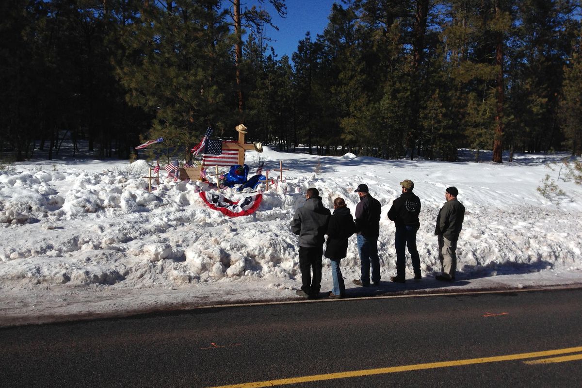 Mourners gather Sunday, Jan. 31, 2016, at roadside memorial for rancher LaVoy Finicum near Burns, Oregon. Finicum was killed Tuesday night in a confrontation with the FBI and Oregon State Police on a remote road. (Nick K. Geranios / Associated Press)