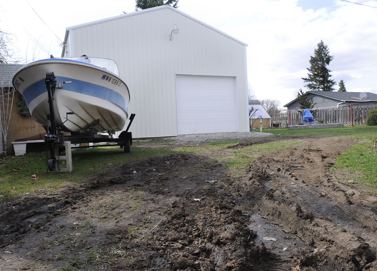 The Bains’ garage has room for two vehicles. It also includes living quarters. (Dan Pelle / The Spokesman-Review)
