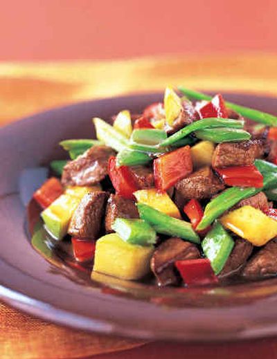 
 Crunchy Apple Beef, a stir-fry using crisp, tart Granny Smith apples, was created by master chef Martin Yan.  
 (Associated Press / The Spokesman-Review)