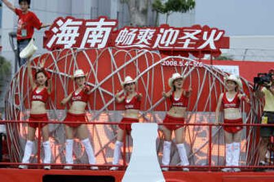 
Coca-Cola cheerleaders perform on a truck in the Olympic torch relay this month in Qionghai, China. Associated Press
 (File Associated Press / The Spokesman-Review)