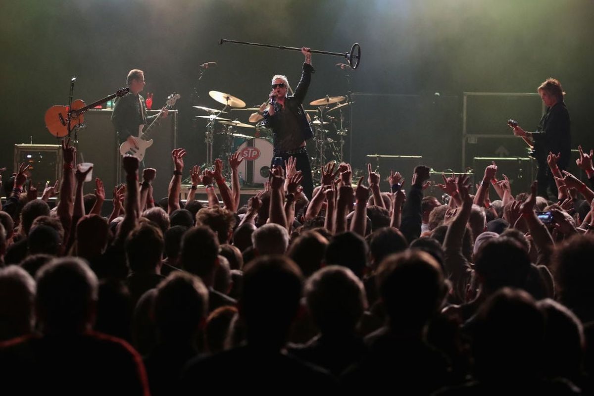 Singer Jeff Gutt, center, guitarist Dean DeLeo, right, bass player Robert DeLeo, left, and drummer Eric Kretz of Stone Temple Pilots perform at Marquee Theatre on March 10, 2018, in Tempe, Ariz. The band will perform Friday as part of MultiCare’s Heart Strings event benefiting behavioral health programs.  (Getty Images)