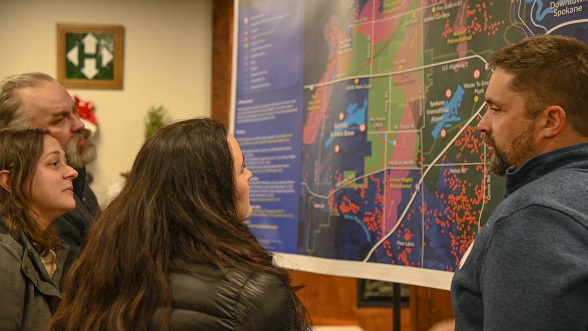 West Plains residents study a map of private wells contaminated with PFAS.  (Courtesy of West Plains Water Coalition)