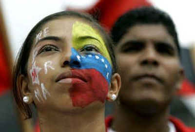 
A supporter of President Hugo Chavez marches Wednesday. Associated Press
 (Associated Press / The Spokesman-Review)