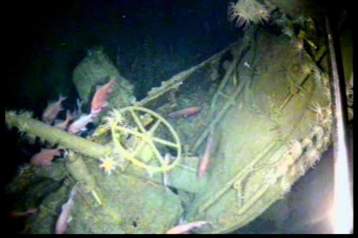 Fish swim around the helm of the Australian submarine HMAS AE1 off the coast of the Papua New Guinea island of New Britain in this image provided by the Australian Department of Defense. One of Australia's oldest naval mysteries has been solved after the discovery of the wreck of the country's first submarine more than 103 years after its disappearance in World War I. (HOGP / Associated Press)