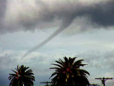 
A funnel cloud is seen over the Pacific Ocean off Venice Beach Tuesday in Los Angeles.
 (Associated Press / The Spokesman-Review)