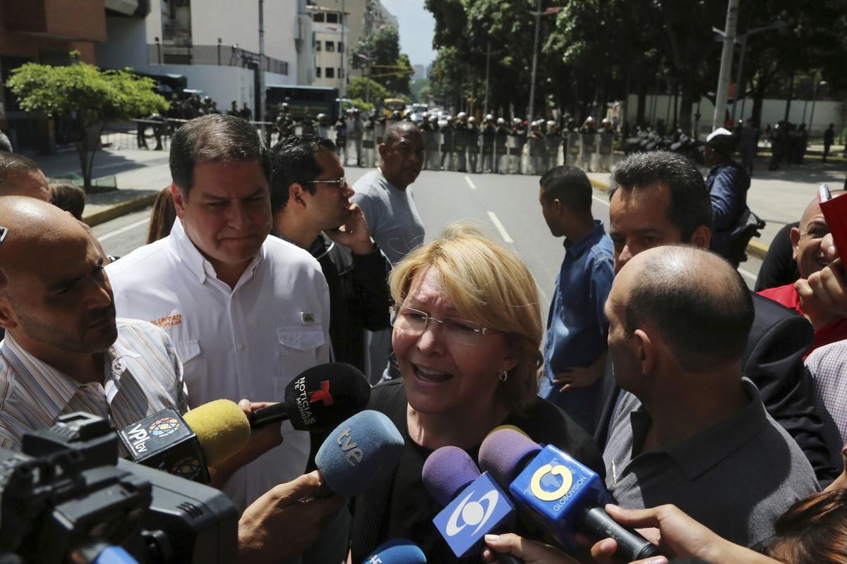 Venezuelan General Prosecutor Luisa Ortega Diaz speaks to the media outside her office after security forces surrounded the entrance, in Caracas, Venezuela, Saturday, Aug. 5, 2017. (Wil Riera / Associated Press)