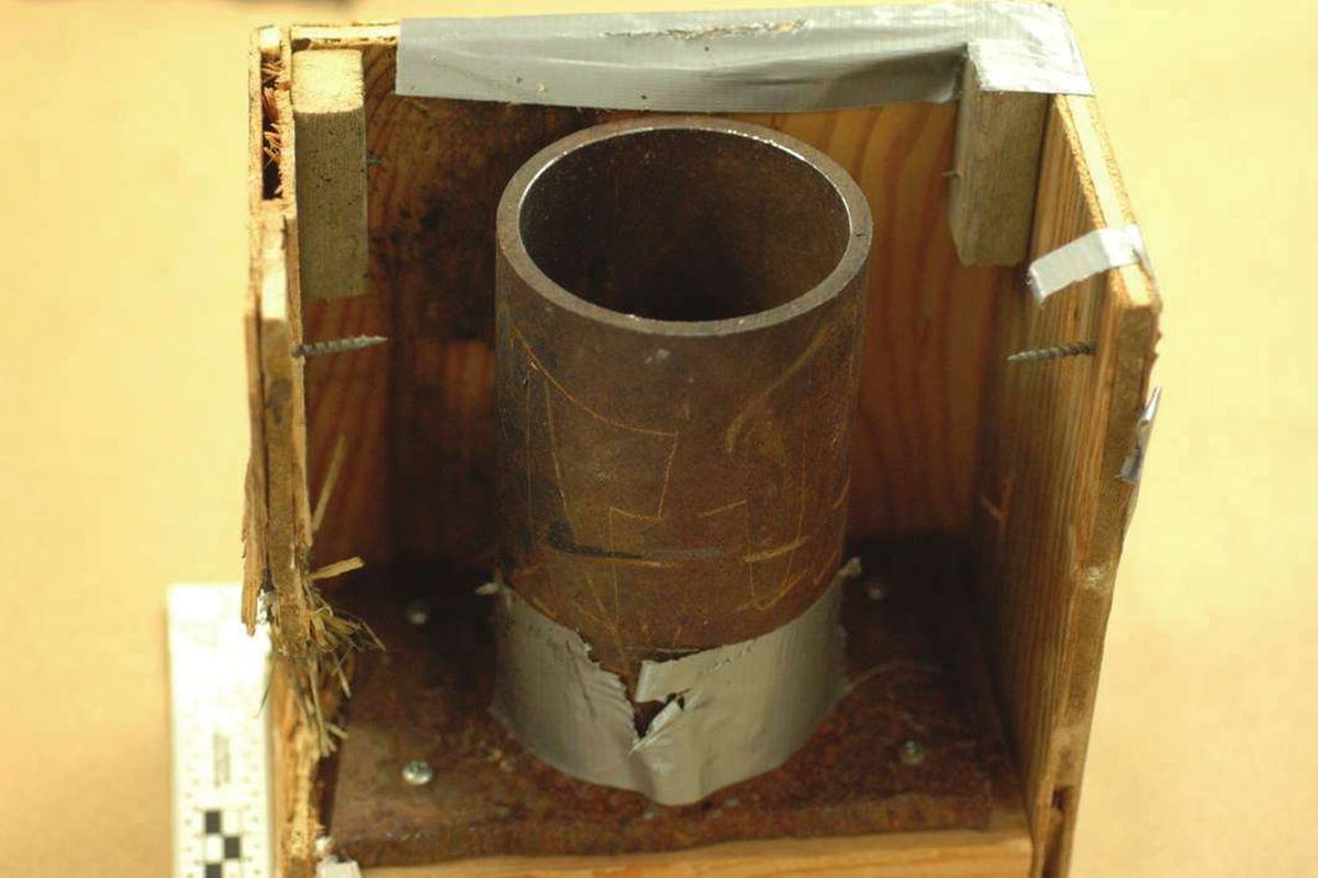 The main charge assembly consisted of a steel pipe with a hole drilled at its base. The pipe was welded to a roughly cut steel plate. (Federal Bureau of Investigation)
