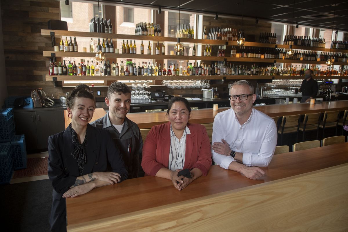 The team at Tavolata – general manager and beverage director Tania Siff, executive chef Scott Siff, regional manager Mary Hamamoto and CEO and founder Ethan Stowell – are photographed at the downtown restaurant on Friday, May 7, 2021. (Kathy Plonka/The Spokesman-Review)