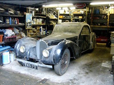 In this  image released by Bonhams, an extremely rare 1937 Bugatti Type 57S Atalante is seen in a garage in Gosforth, England, where it was found by relatives after the death of the owner.  (Associated Press / The Spokesman-Review)