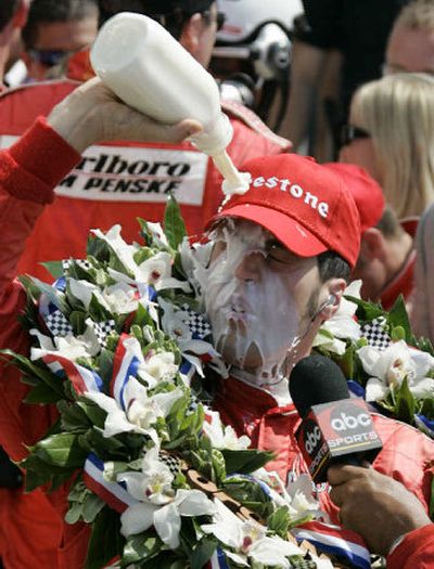 
Sam Hornish Jr. douses himself with milk in Victory Circle after his win in the Indianapolis 500 on Sunday.
 (Associated Press / The Spokesman-Review)