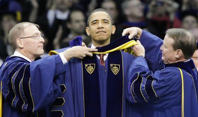 President Barack Obama  receives an honorary doctorate degree in laws during commencement ceremonies at the University of Notre Dame  on Sunday.  (Associated Press / The Spokesman-Review)
