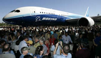 
Associated Press photos Crowds gather around the first production model of the new Boeing 787 Dreamliner during Sunday's ceremony in Everett.
 (Associated Press photos / The Spokesman-Review)