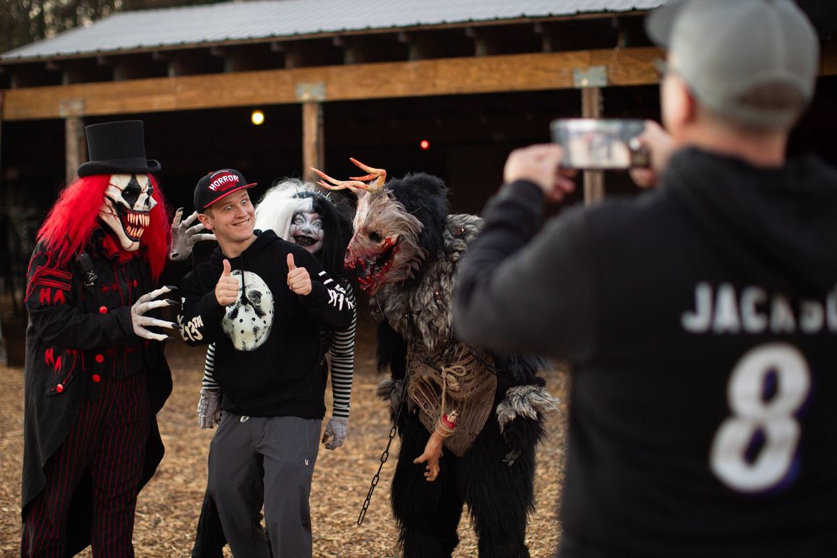 Jack Bruner poses with Stitchy and other scare actors. Bruner comes to Field of Screams with his father every year from Annapolis. MUST CREDIT: Maansi Srivastava for The Washington Post  (Maansi Srivastava/Maansi Srivastava for The Washington Post)