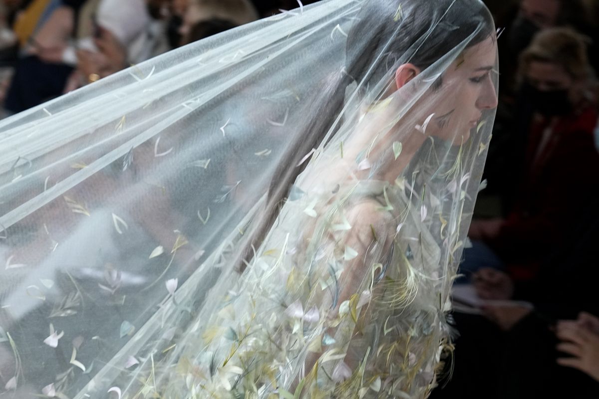 A model wears a creation for Dior's Haute Couture Fall-Winter 2021-2022 fashion collection presented Monday, July 5, 2021, in Paris.  (Michel Euler)
