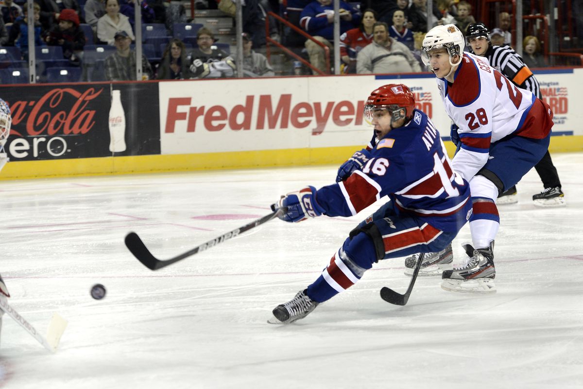 Chiefs’ Mike Aviani strikes for the game’s first score with this short-handed goal against Edmonton’s Laurent Brossoit, left, and Martin Gernat. (Dan Pelle)