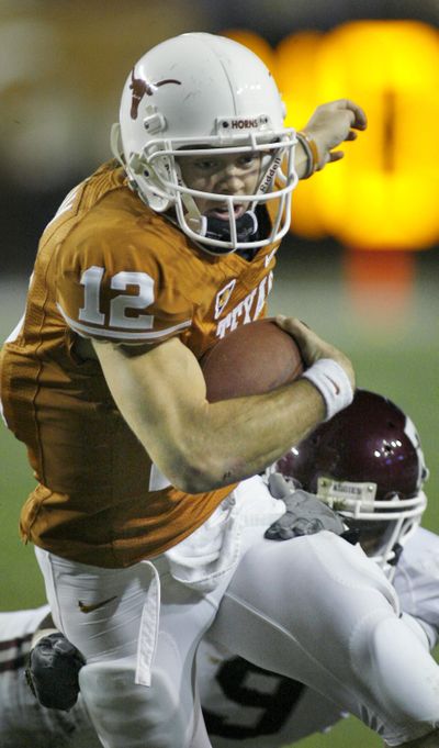 Colt McCoy ran for two and threw for two for Texas. (Associated Press / The Spokesman-Review)