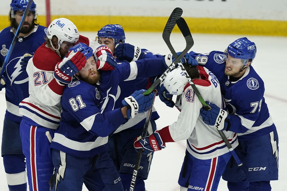 Tampa Bay Lightning defenseman Erik Cernak (81) and Montreal Canadiens right wing Paul Byron (41) are separated during the third period in Game 1 of the NHL hockey Stanley Cup finals, Monday, June 28, 2021, in Tampa, Fla.  (Gerry Broome)