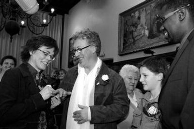 
Alderman  Wouter Van Bellingen, right, presides over the wedding of Geert Brokken, center, and Leen Ost at the Town Hall of Sint-Niklaas, Belgium, on Wednesday. 
 (Associated Press / The Spokesman-Review)