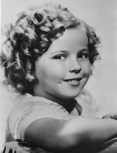 FILE - In this November 1936 file photo, 8-year-old U.S. American child movie star Shirley Temple is portrayed in Hollywood, Calif. Shirley Temple, the curly-haired child star who put smiles on the faces of Depression-era moviegoers, has died. She was 85. Publicist Cheryl Kagan says Temple, known in private life as Shirley Temple Black, died Monday night, Feb. 10, 2014, surrounded by family at her home near San Francisco. (Associated Press)