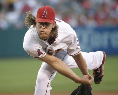 L.A.’s Jered Weaver struck out 12 in seven innings. (Associated Press)
