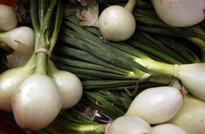 
Walla Walla salad onions from the Deasis family farm were one of the offerings at a recent farmers' market.
 (Jed Conklin / The Spokesman-Review)