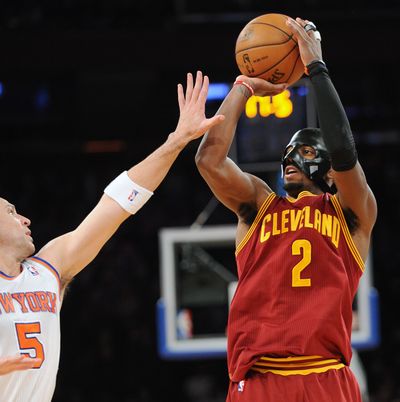 After breaking his jaw Friday, Cavs’ Kyrie Irving donned a protective face mask and scored 41 points. (Associated Press)