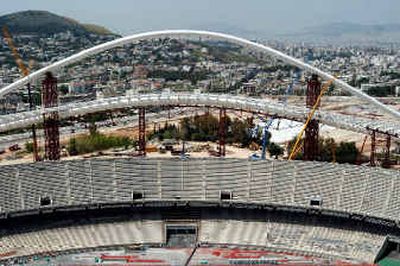 
The roof of the main Olympic Stadium — including the western support arch shown here — is a major construction hang-up.The roof of the main Olympic Stadium — including the western support arch shown here — is a major construction hang-up.
 (Associated PressAssociated Press / The Spokesman-Review)