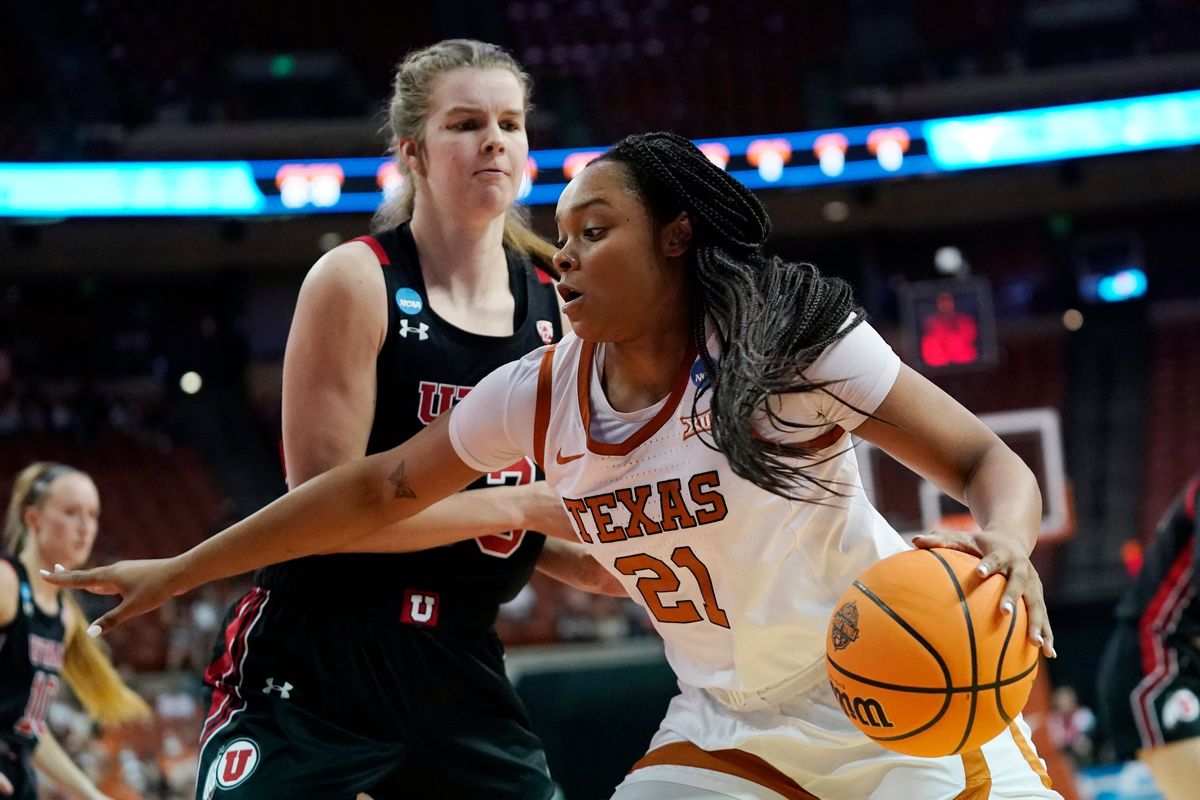 Texas forward Aaliyah Moore (21) drives around Utah forward Kelsey Rees, left, during the second half of a college basketball game in the second round of the NCAA women