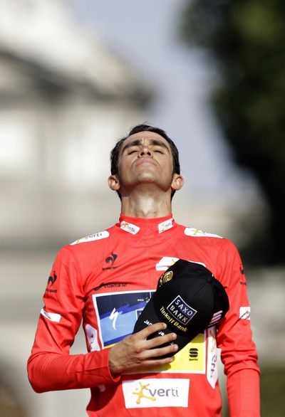 Winner Alberto Contador listens to the Spanish national anthem at the podium of the Spanish Vuelta cycling race Sunday. (Associated Press)